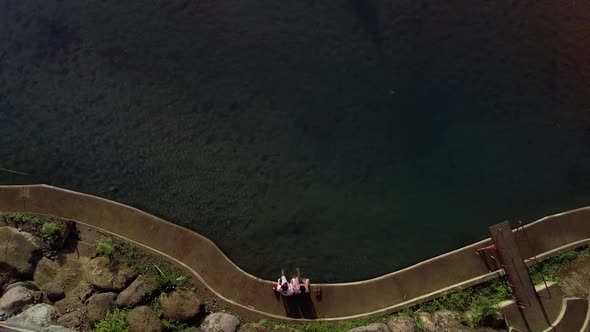 Top shot of a couple dating on a river side