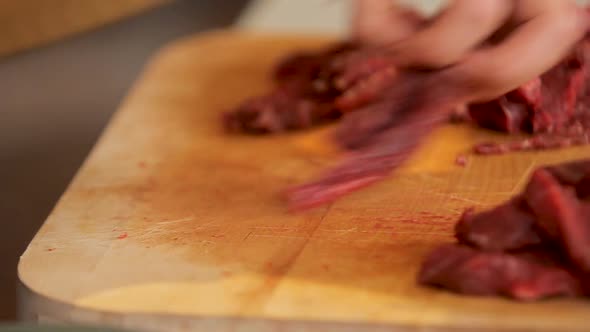 Slicing Beef on a Board