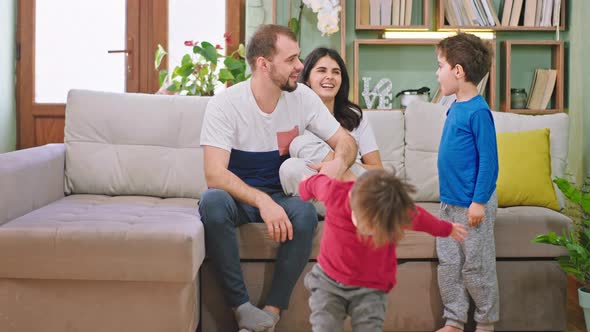 Smiling Large and Happy Young Family with Two Kids