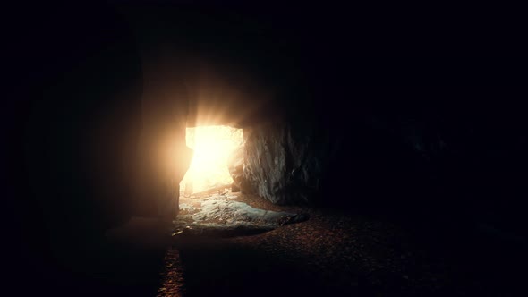 Breathtaking Scenery of Bright Sun Rays Falling Inside a Cave Illuminating