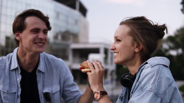 Happy Young Couple are Hanging Out in the Park