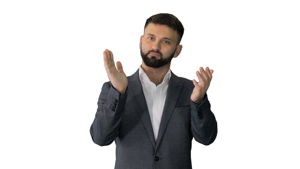 Man looking at camera and applauding on white background.