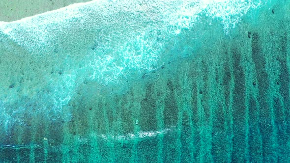 Aerial View Of Waves Crashing On Beach In Real Time, high angle background shot