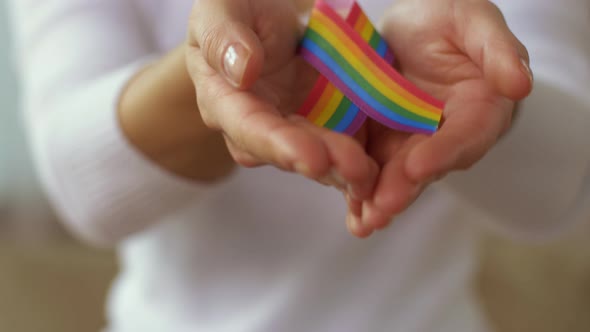 Woman Holding Gay or Lgbt Pride Awareness Ribbon 14