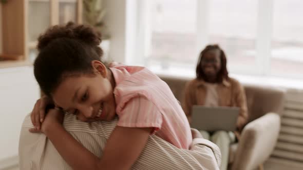 African School Girl Hugging Dad