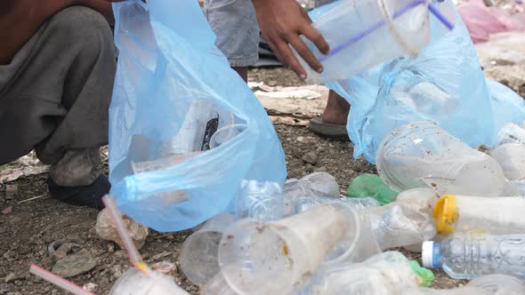 Poor Children Collecting Trash For Sell