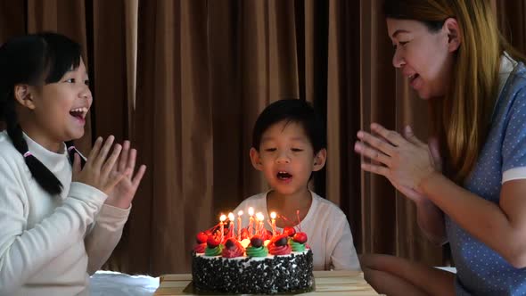 Asian Family With Birthday Cake