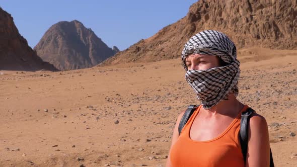 Girl in the Keffiyeh in Desert of Egypt