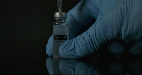 Covid Vaccine Test In Rubber Gloves