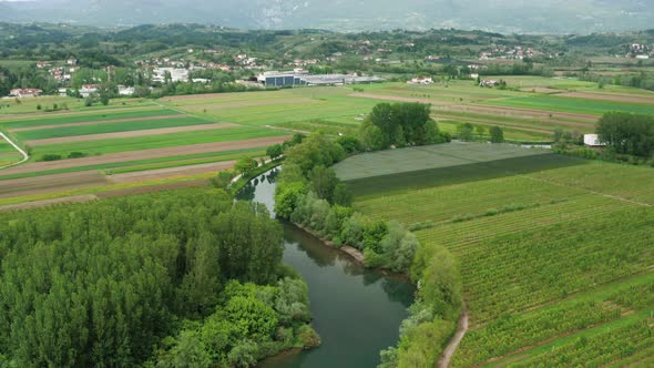 The beautiful countryside of Vipava in Slovenia with river, agricultural fields and houses in the ba