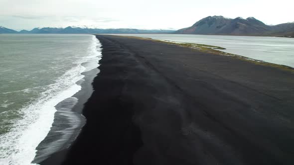 Drone Over Black Sand Beach And Tide Near Estrahorn Mountain