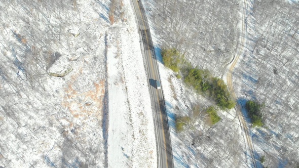 Delivery Truck Driving On Country Road In Winter