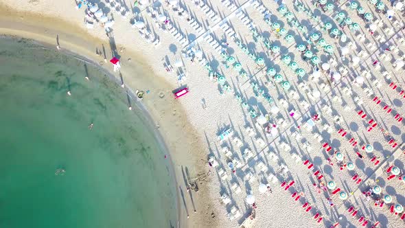 Tourist Beach And With Umbrellas