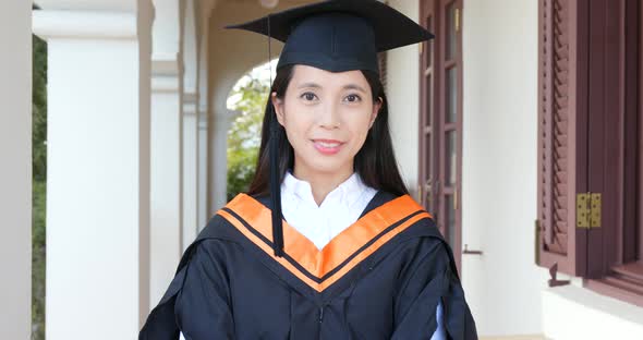 Asian woman get graduation in university campus