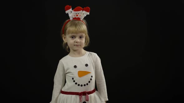 Happy Beautiful Baby Girl in Snowman Costume. Christmas. Make Faces, Dance