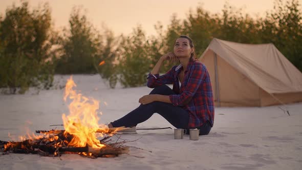 Tourist Woman in the Camp Near Campfire