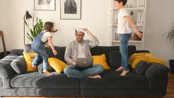 Crazy Irritated Father Screaming with Eyes Closed Closing Ears with Palms