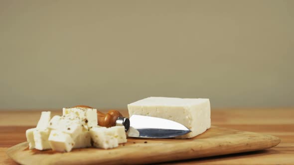 Slices of cheese with knife