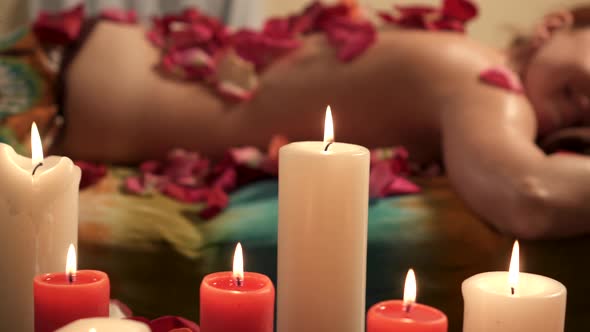 Satisfied Young Woman Relaxes After Massage in Spa Salon, Slider Shot