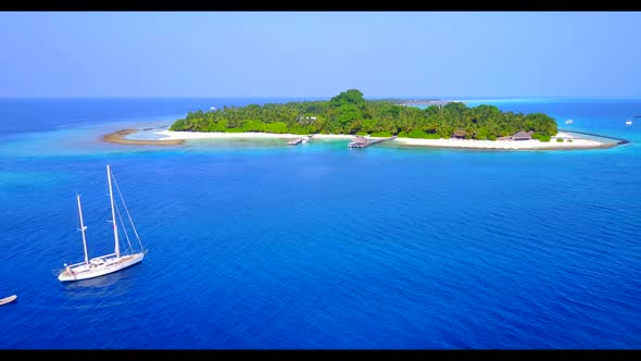 Aerial drone view tourism of perfect bay beach lifestyle by blue sea and white sandy background of a