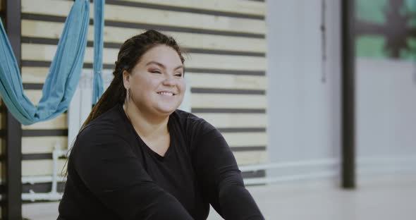 Happy Body Positive Woman Smiling and Laughing After Doing Stretching Exercise on Hammocks