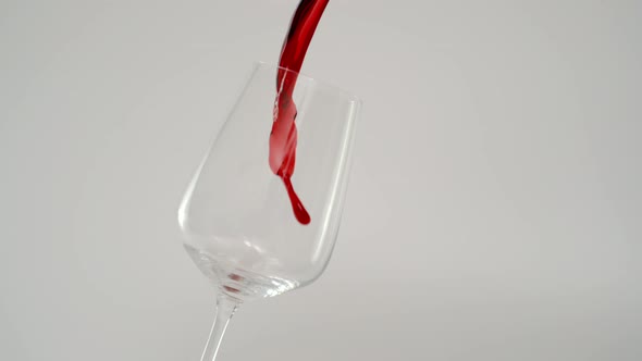 Slow Motion of Red Wine Splashing in Glass , 1000 fps