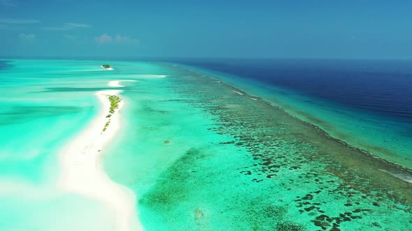 Aerial drone scenery of luxury sea view beach wildlife by blue sea with white sandy background of a 