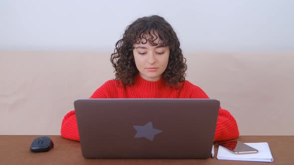 Freelancer female working on modern notebook computer at home in 4k video