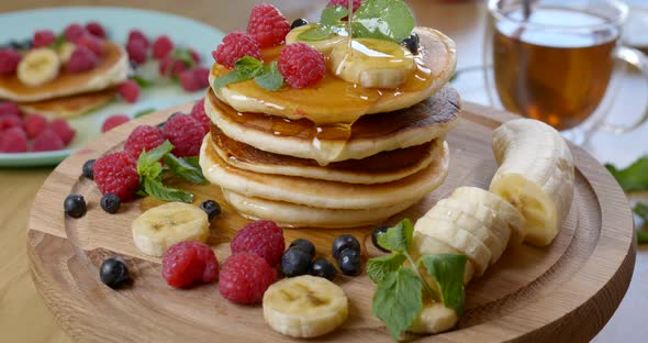 Sweet Honey Pouring Over Pancakes