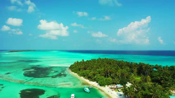 Aerial abstract of idyllic bay beach wildlife by shallow sea with white sandy background of a dayout