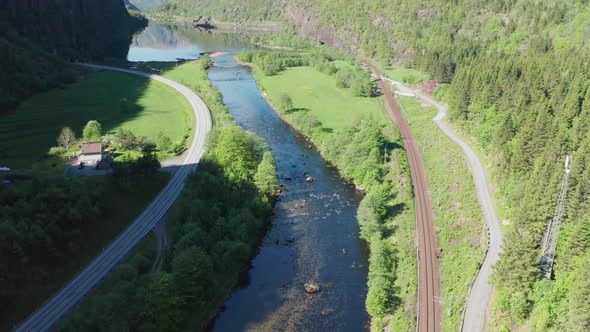 Dalevågen in Vaksdal Norway - Aerial view of E16 with tunnel and Dale-river close to railroad Bergen