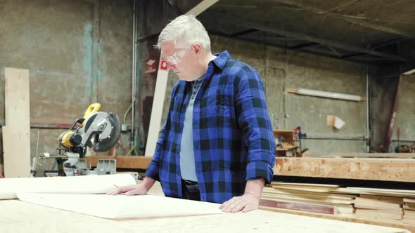 Carpenter at work in woodshop