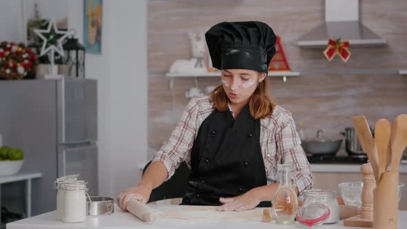 Grandchild Celebrating Christmas Holiday Preparing Traditional Homemade Dough