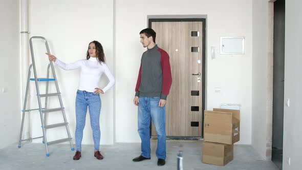 A Young Attractive Couple Moving Into a New Home