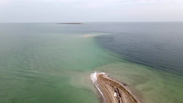 Bride at Uninhabited Sand Island in Ocean Reef,  Drone High Ungraded Video