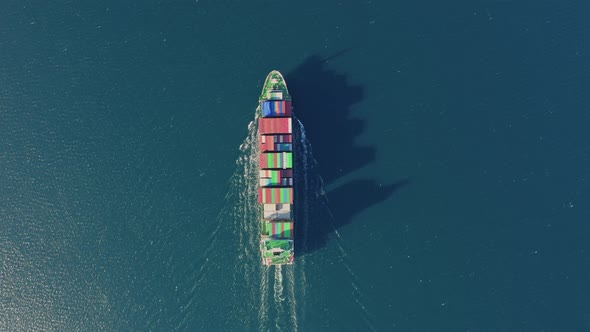 Ultra Large Container Ship Sailing at Sea Aerial Top Down View