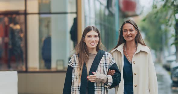 Happy and Beautiful Girls Go Shopping From the Store