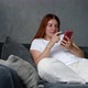 Woman Using Cell Phone in Living Room - VideoHive Item for Sale