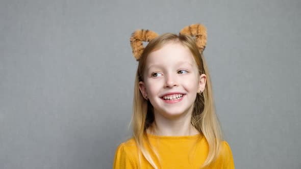 Cute Smiling Blond Girl with Tiger Ears