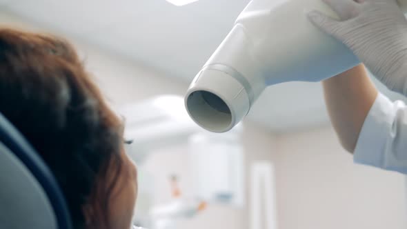 Dentist is Getting Ready to Use a Medical Machine