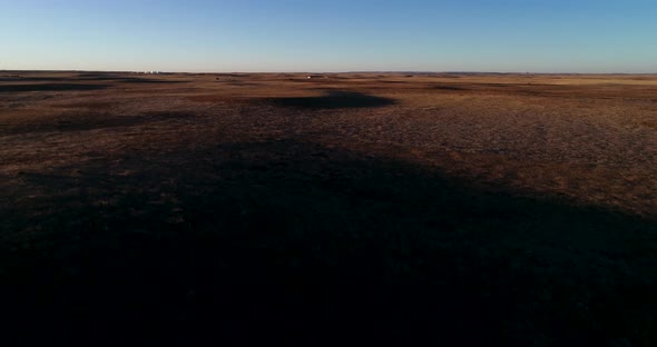 An ascending flight during sunset to show the vastness of the North American Great Plains