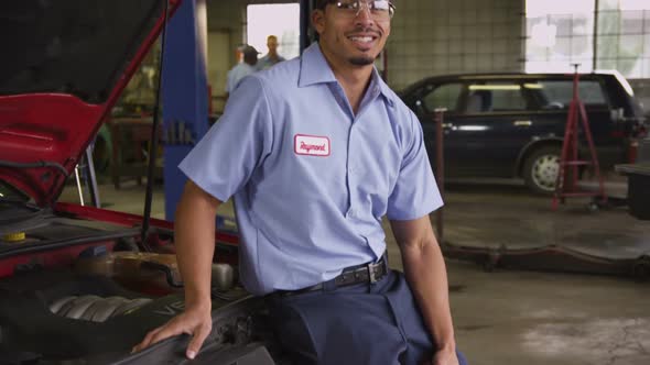 Portrait of auto mechanic in repair shop