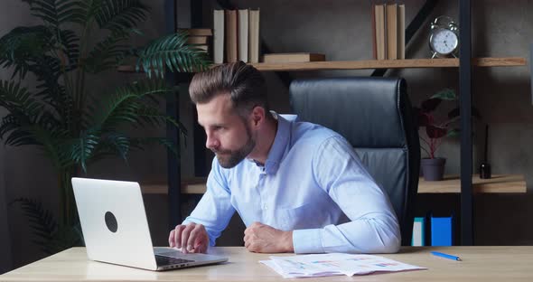 Excited Business Man Checking Email Reading Great News on Laptop