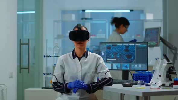 Laboratory Doctor Experiencing Virtual Reality Using Vr Goggles alt
