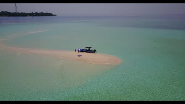 Aerial above seascape of relaxing shore beach vacation by blue lagoon and white sandy background of 