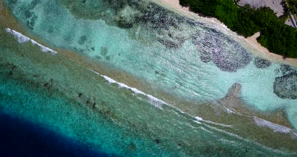 Luxury above abstract shot of a white sand paradise beach and blue sea background in colorful 4K