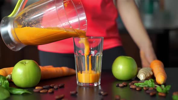 Pouring Smoothie From Blender Into Glass