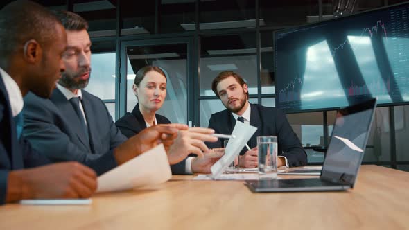 Business team discussing a project at a meeting in the office