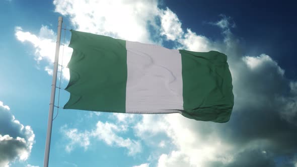 Flag of Nigeria Waving at Wind Against Beautiful Blue Sky
