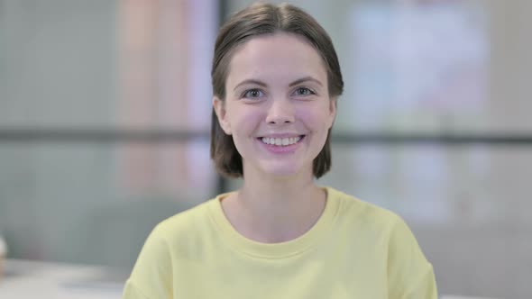 Portrait of Young Woman Smiling at Camera